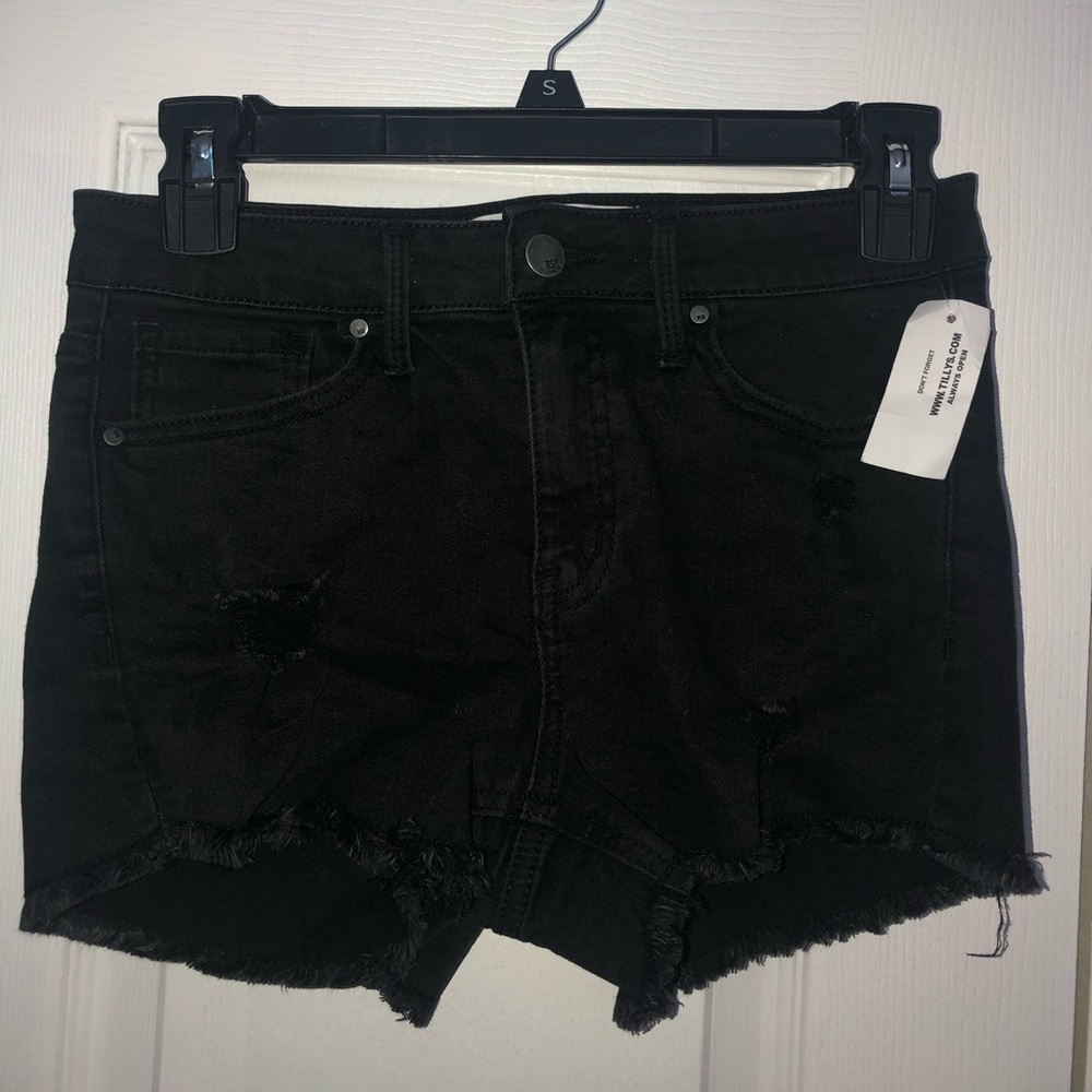 Black ripped jean shorts.